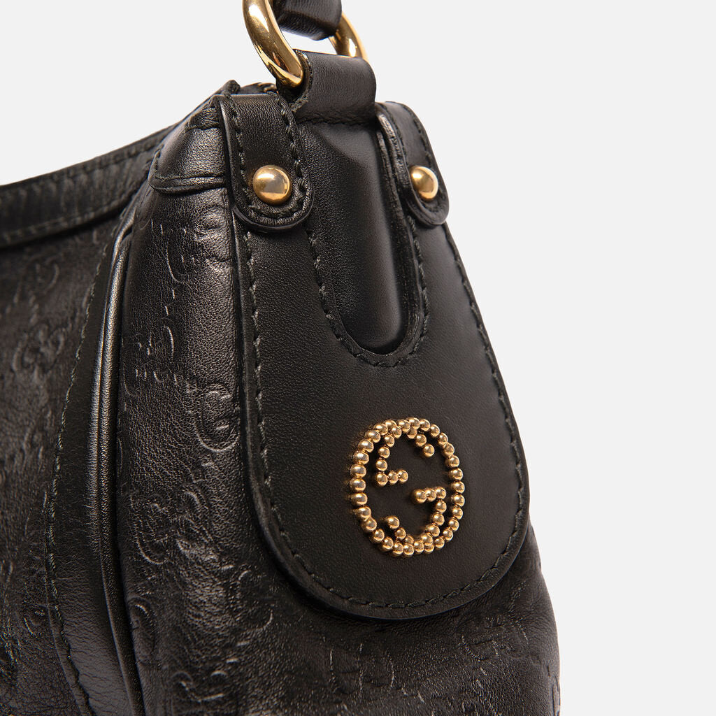 Gucci Black Leather Empreinte Hobo