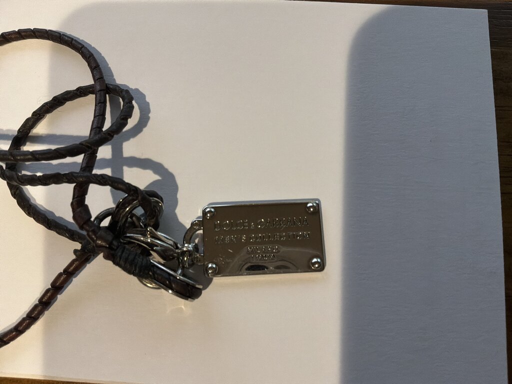 STERLING D& G DOG TAG ON BROWN LEATHER CHORD