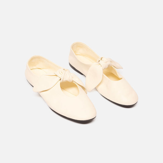 Co Ivory Leather Bow Tie Flat